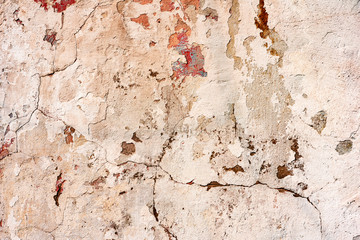Texture of a concrete wall with cracks and scratches which can be used as a background