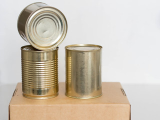 tin cans on a craft box
