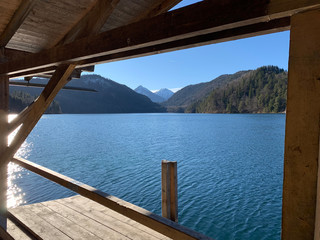 Stunning view of the Alpsee lake on a sunny day near Neuschwanstein castle. Schwangau, Bavaria, Germany