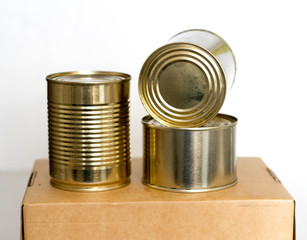 tin cans on a craft box