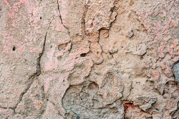 Texture of a concrete wall with cracks and scratches which can be used as a background
