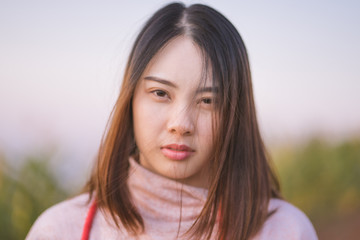 Portrait of beautiful Asian young woman smiling.