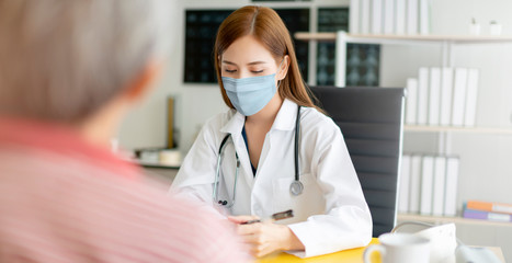 group of doctor and nurse wear protection mask checking and takecare infection people from covid-19 pandemic spread in clinic hospital background © whyframeshot