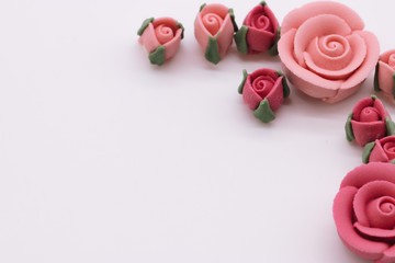 Naklejka na ściany i meble pink decorative sugar rose on a white background. wedding, mothers day, valentine card concept. copy space