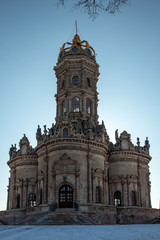 Old church in the shade against a blue sky