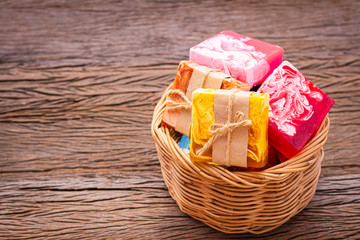 Soap made from natural and colorful in a basket placed on a wooden background. For cleaning germs