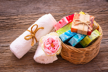 Soap made from natural and colorful in a basket placed on a wooden background. For cleaning germs