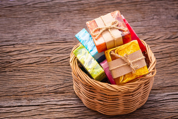 Soap made from natural and colorful in a basket placed on a wooden background. For cleaning germs