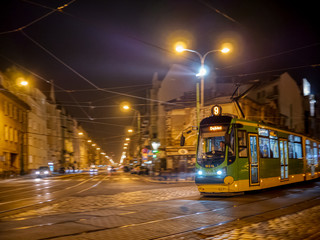 Naklejka na ściany i meble City transportation at night. Poznan, Poland.