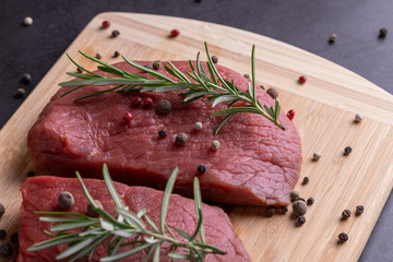 fresh raw sliced beef meat steak on a wooden board