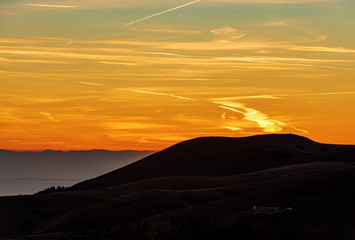 Lessinia plateau (Altopiano della Lessinia) and Padan plain (Pianura Padana) with fog at sunset. Verona province, Veneto, Italy, Europe