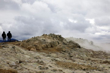 Hverir / Iceland - August 30, 2017: Tourists walking at Hverir geothermal and sulfur area near Namafjall mountain, Myvatn Lake area, Iceland, Europe