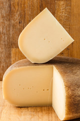 block of cheese on wood background 