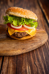homemade hamburger on a wooden board. 