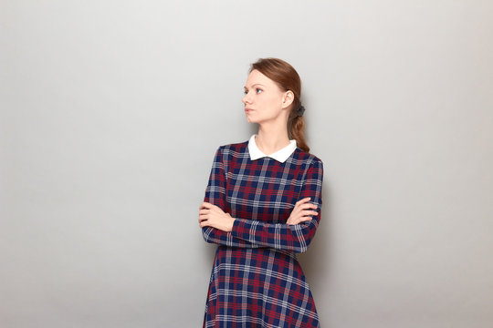 Portrait of serious focused annoyed girl crossing arms over body