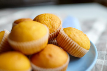 Muffins, homemade bakery. Pumpkin muffins on blue plate