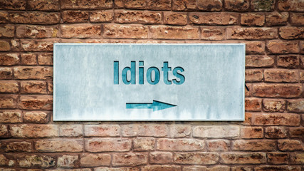 Fototapeta na wymiar Street Sign to Idiots