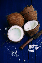 Coconuts on a bright wooden background close-up