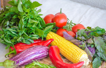 Raw vegetables close up. Top view of fresh tomatoes, basil, eggplant, red pepper and corn. Healthy eating concept, vegetable background. Selective focus image, flat lay.