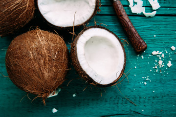 Fototapeta na wymiar Coconuts on a bright wooden background close-up