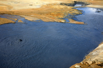 Hverir / Iceland - August 30, 2017: Hot water at Hverir geothermal area near Namafjall mountain, Myvatn Lake area, Iceland, Europe