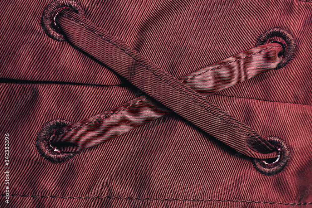 Poster Close up beautiful red textile cloth background with stitching. Macro photography background material view.