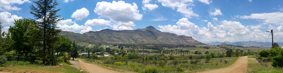Fluffy clouds over rock formations in the Golden Gate Highlands National Park, Clarens, Free State, South Africa
