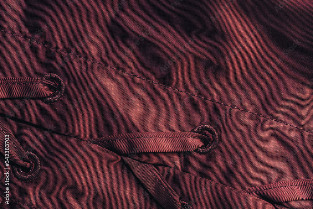 Poster Close up beautiful red textile cloth background with stitching. Macro photography background material view.
