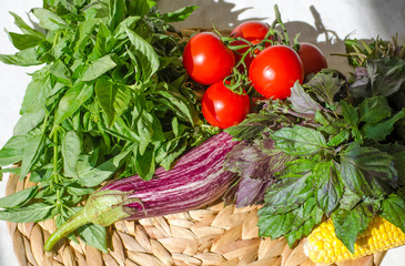 Raw vegetables close up. Top view of fresh tomatoes, basil, eggplant, red pepper and corn. Healthy eating concept, vegetable background. Selective focus image, flat lay.