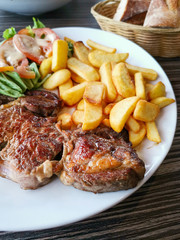 juicy steak beef meat with tomato and french fries