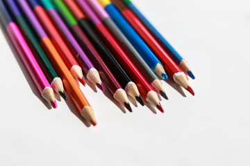 colored pencils on white background