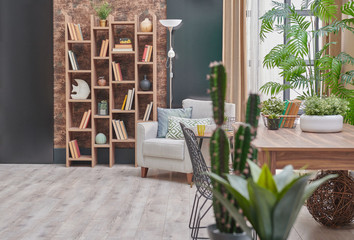 Modern brown and black wall concept, wallpaper, wooden bookcase and table style, grey armchair green vase of plant.
