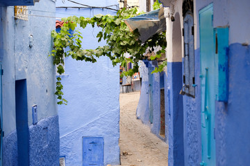 Narrow blue painted street in city of  Chefchaouen,Morocco.