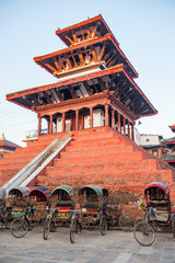 Colorful and tradional nepalese rickshaws in front of a temple at Durbar square in Kathmandu. Empty...