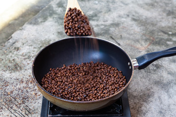 Traditional roasting coffee at home,  freshly roasted coffee beans.