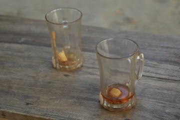 A teacup is a cup for drinking tea. It may be with or without a handle, generally a small one that may be grasped with the thumb and one or two fingers.
