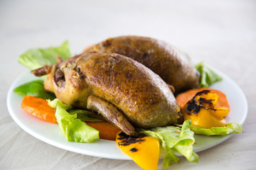Close-up view of roasted spatchcock in plate