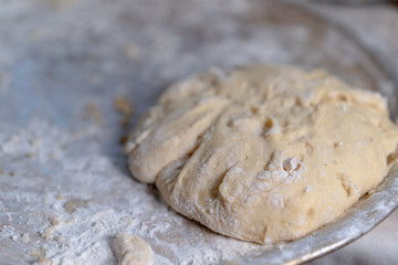 Ready dough lies on a tray