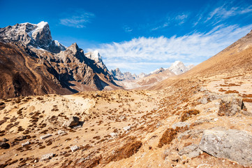 Valley leading to the Everest base camp with Tawoche / Taboche peak. Trekking in Nepal Himalayas. EBC (Everest base camp trek) trail upper part from Lukla to EBC of Everest trek. Nepal.