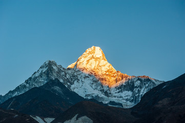Sunrise on Ama Dablam peak mountain. Trekking in Nepal Himalayas. EBC (Everest base camp trek)...