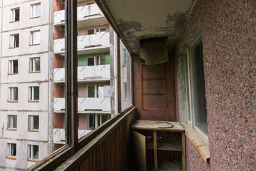 Fototapeta na wymiar Balcony in abandoned ghost town Pripyat in Chernobyl zone