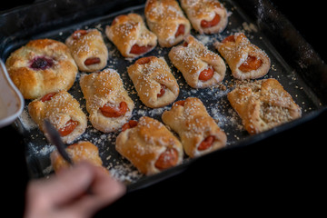 Sweet pastries on a baking sheet from the oven