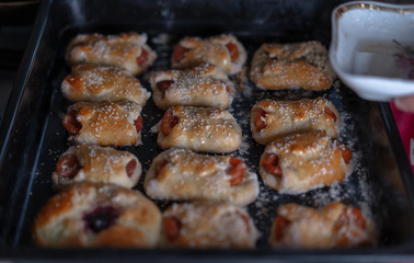 Sweet pastries on a baking sheet from the oven