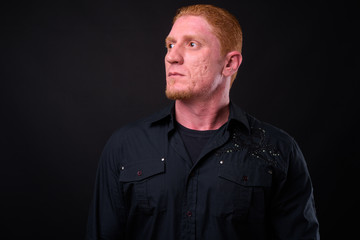 Obraz premium Portrait of muscular man with orange hair thinking