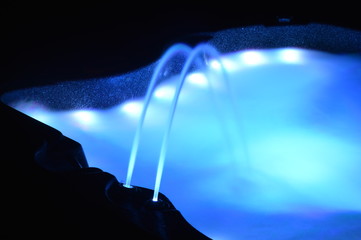 Closeup on a spa with interior lighting at night