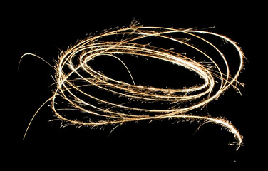 light painting with fireworks in isolated natural background. sparks are spreading