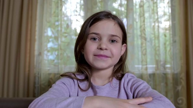 Little girl having a video call at home