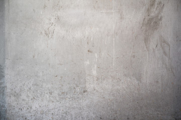 dirty smooth concrete wall background texture with stains and copy space