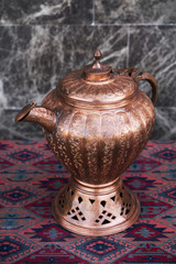 Retro vintage teapot on table. Antique turkish coffee pot
