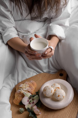 woman eating breakfast in bed